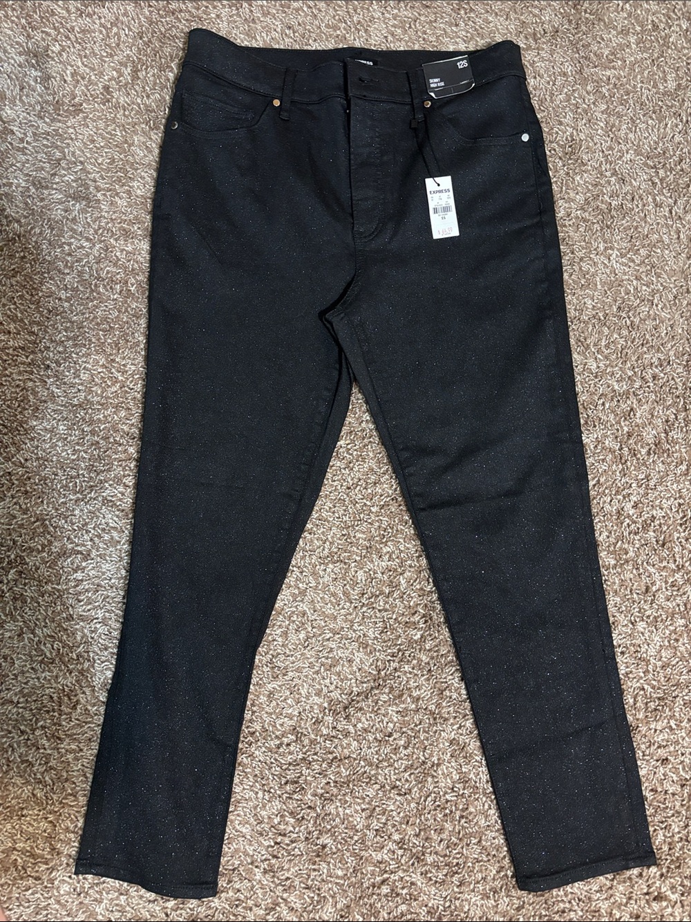 Black Sparkle Skinny Express 43% cotton 28%polyester 28% Rayon 1% spandex jeans